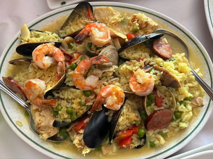 Hearty seafood rice dish with shrimp and mussels from Perla Restaurant.