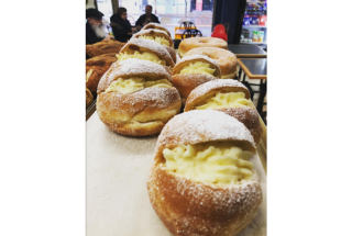 Sugary Portuguese donuts filled with cream at Progress Bakery.